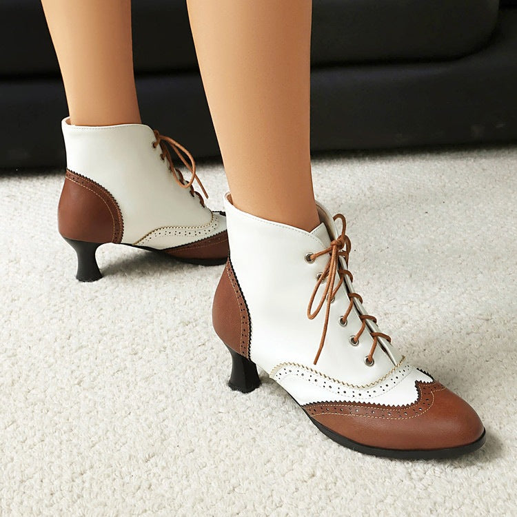 Vintage brogue lace up ankle boot in two tone cream with round toe, wingtip perforations and a low spool heel