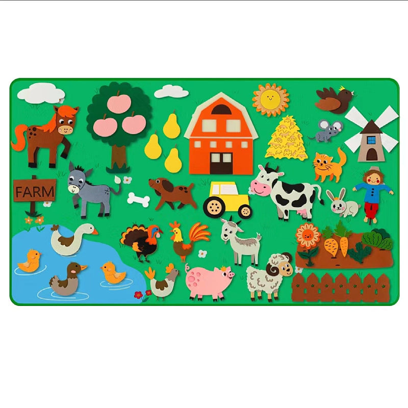 Farm themed felt story board with felt barn, tractor and farm animal pieces on green felt