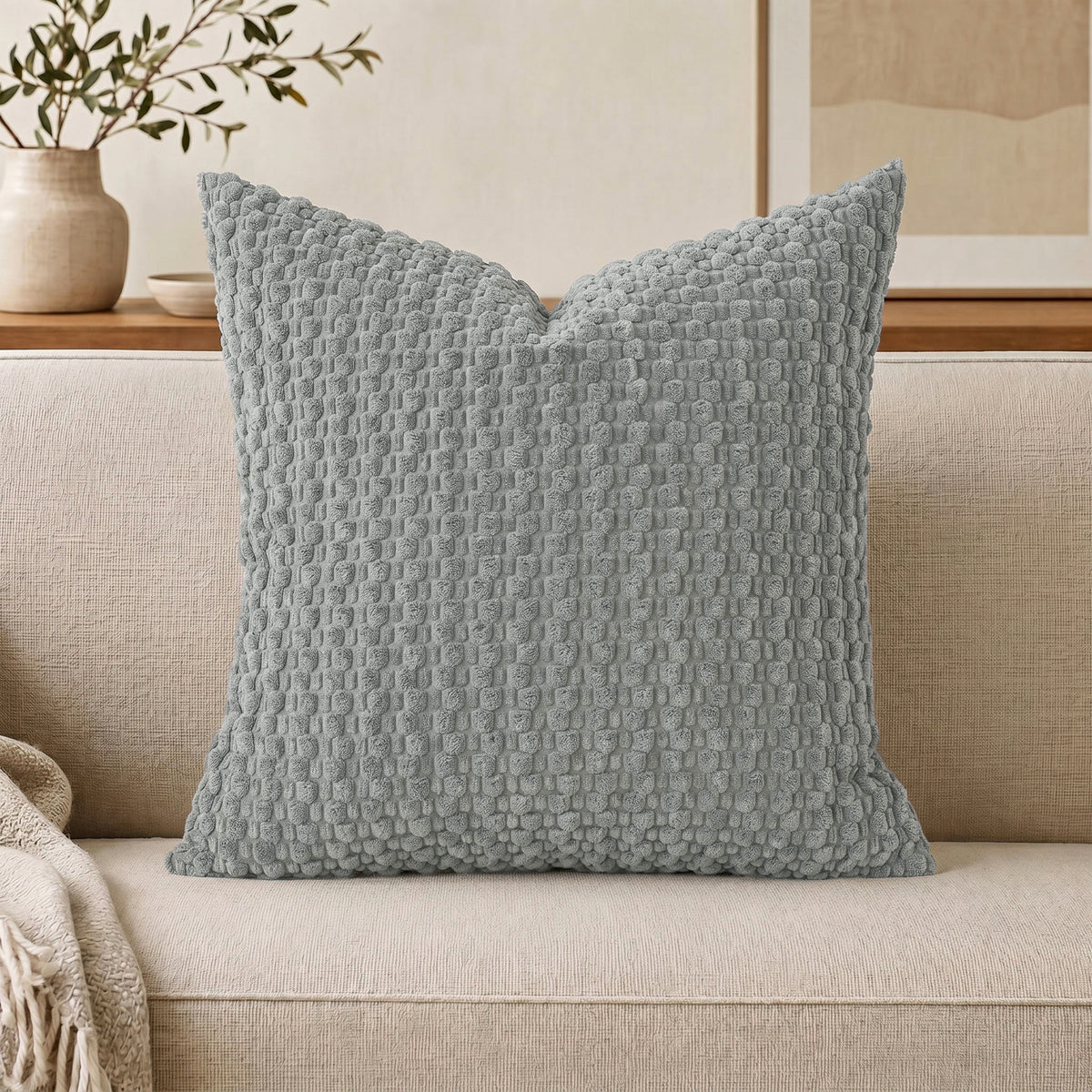 Raised popcorn texture on a plush decorative throw pillow cover