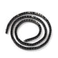 Coiled tennis chain necklace with black stones, a style the maker shows that is not among the options