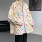 Distressed button shirt with frayed squares showing flecks of colour, loose oversized cut