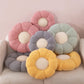 Close up of the chunky knit plush surface of the flower shaped seat cushion