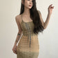 Close-up of the subtle all-over print on the khaki dress fabric