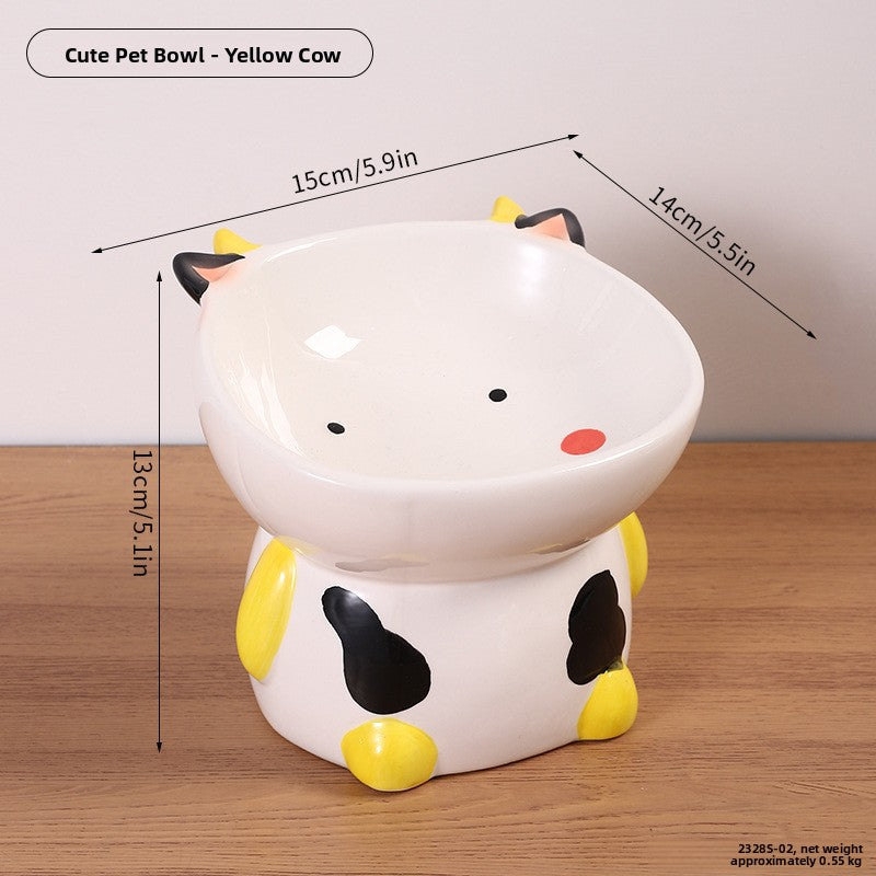 Yellow cow design ceramic raised pet bowl with yellow ears and feet, 15 by 14 cm and 13 cm high