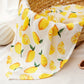 Soft cotton muslin gauze baby blanket shown folded, revealing the light open double layer weave
