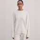 Knit pullover sweater worn layered over a tee for a cool-weather outfit