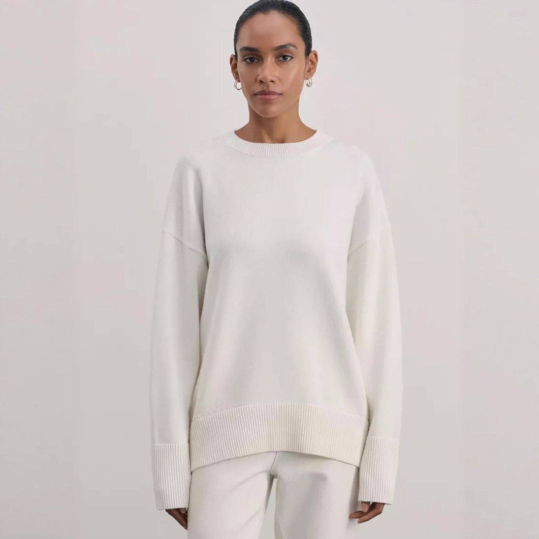 Knit pullover sweater worn layered over a tee for a cool-weather outfit
