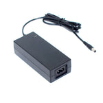Black 72W desktop switching power supply with AC input socket and coiled DC barrel plug output cord, front angled view