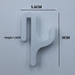 White resin single hook with size marks, 5.6 cm wide and 9 cm tall, seen from the front on a light background