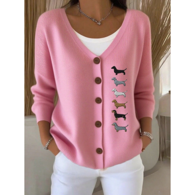 Women's V neck button front knit cardigan in the Pink Dachshund print worn open over a white top