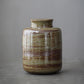 Close detail of the matte glaze finish and custom logo area on the jar