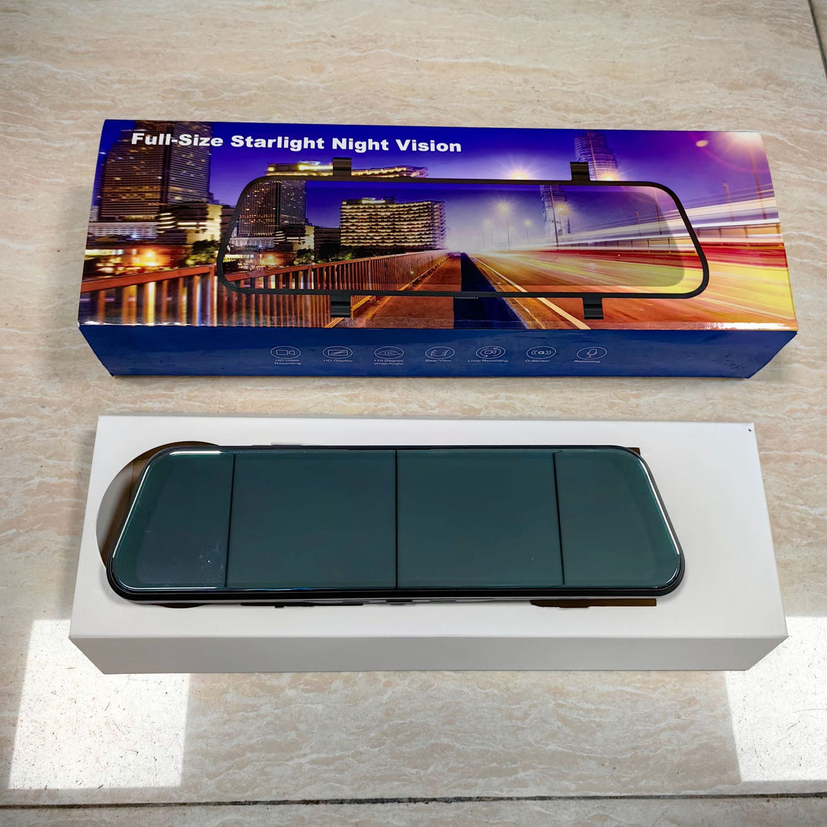 Full size mirror dash cam with its box on a tiled floor, option image for the 12in Touch Front 1296P option