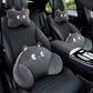 Black cat headrest and lumbar pillows on a front car seat, with a second black cat pair on the rear seat