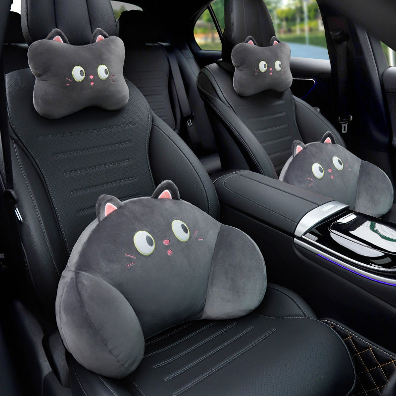 Black cat headrest and lumbar pillows on a front car seat, with a second black cat pair on the rear seat