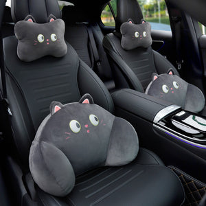 Black cat headrest and lumbar pillows on a front car seat, with a second black cat pair on the rear seat