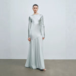 Light mint satin long sleeve boat neck evening gown shown from the front