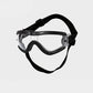 Dog wearing protective goggles on a walk to shield eyes from wind and dust