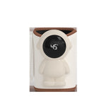 Beige baby bottle warmer sleeve with an astronaut shaped front panel and a round LED display reading 45 degrees