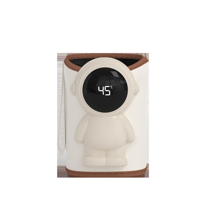 Beige baby bottle warmer sleeve with an astronaut shaped front panel and a round LED display reading 45 degrees