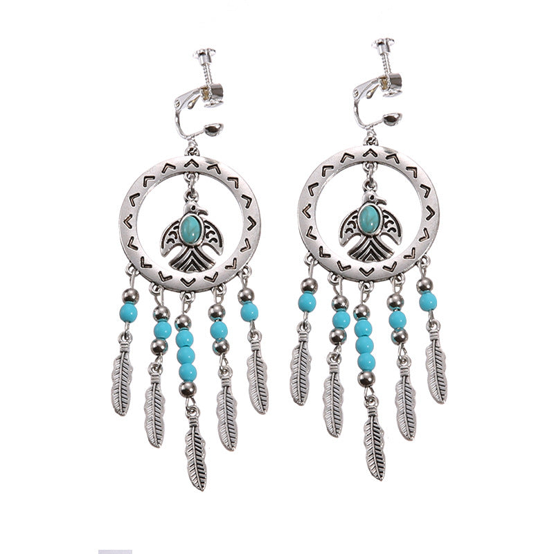 Bohemian vintage clip-on tassel drop earrings on a zinc alloy frame, handmade boho pair on white studio background