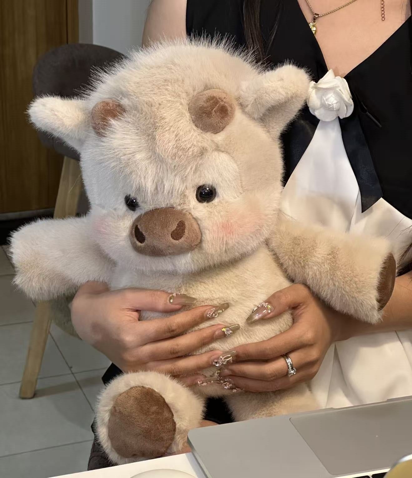 Soft plush animal toy photographed on a clean studio background