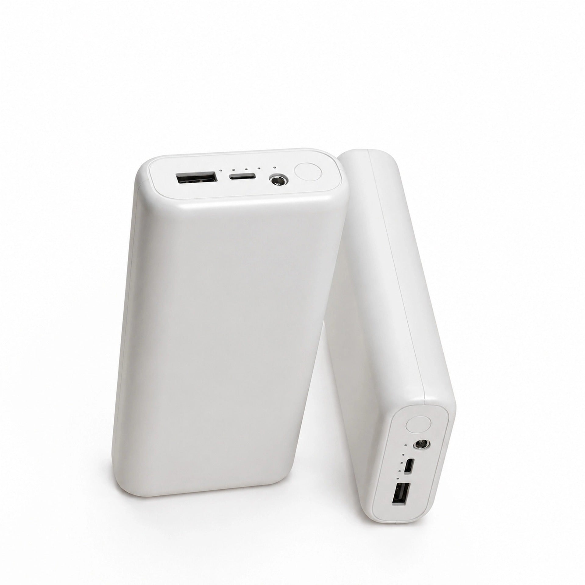 Two white power bank units on white showing the USB-A, USB-C and DC output ports beside the power button