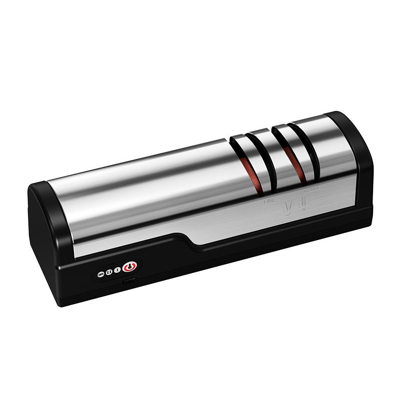 Electric knife sharpener with two grinding slots on a black gripped base in a kitchen