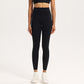 High-waisted nylon and spandex yoga leggings for women, shown on a studio model