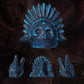 Blue and black ceramic skull death whistle with feather headdress shown with front and side views