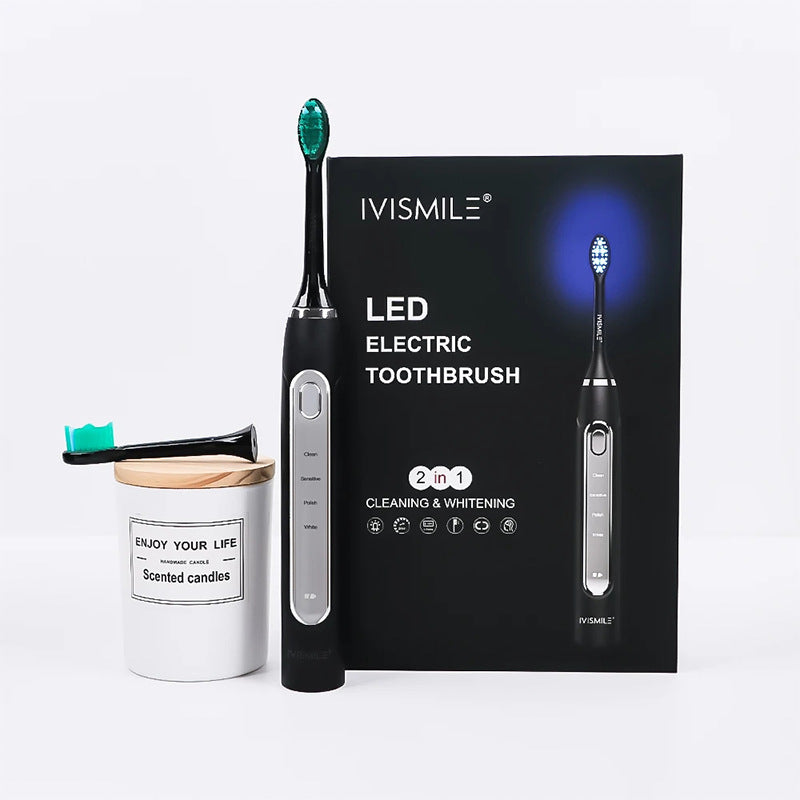 Black IVISMILE LED electric toothbrush beside its retail box and a small jar on a light background