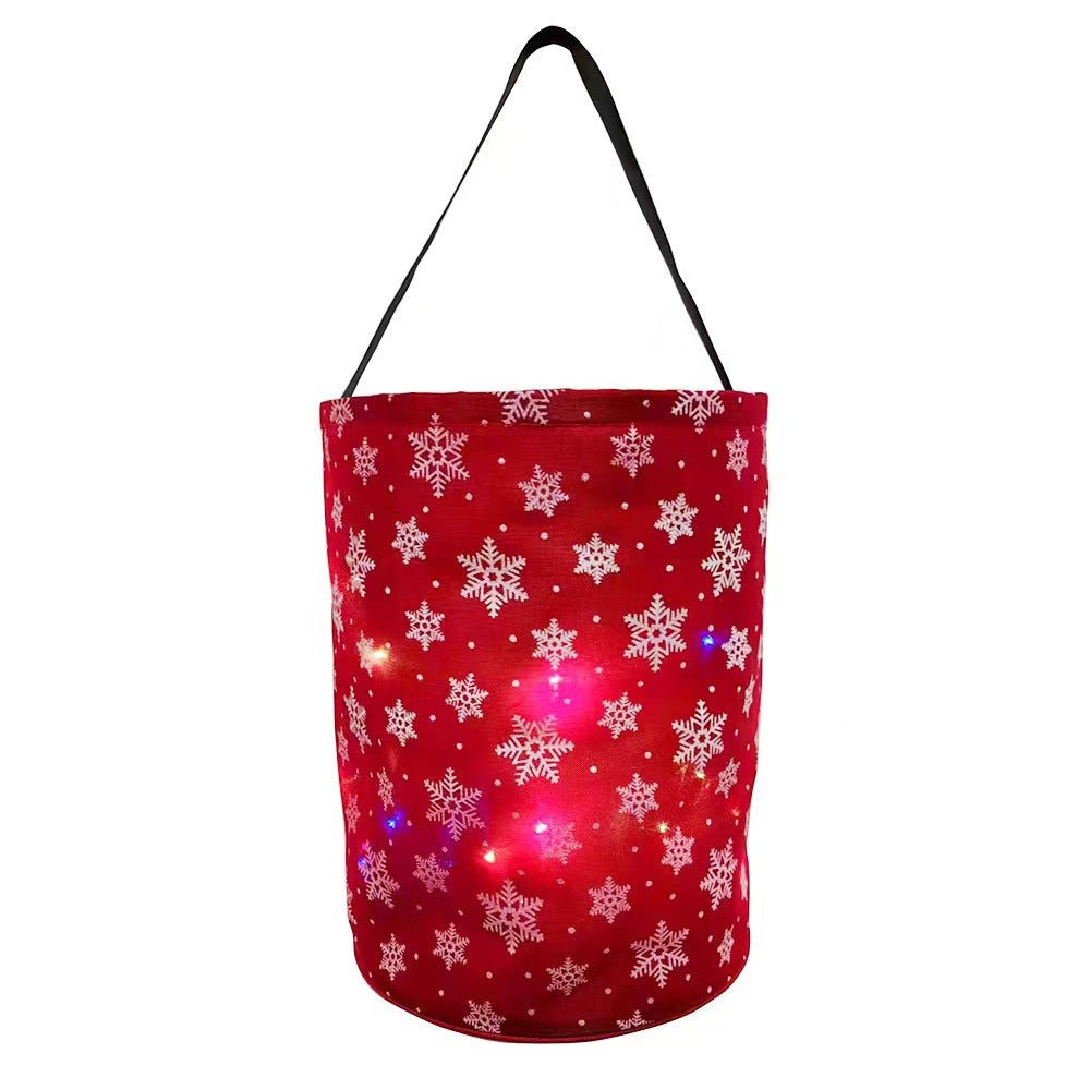 Red Christmas party bucket bag printed with gift boxes and glowing interior LED lights