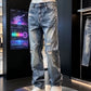 Faded blue distressed straight leg jeans with rips at the thigh, front view on a display mannequin