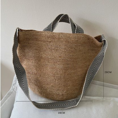 Raffia tote open at the top showing the roomy hand-woven interior space