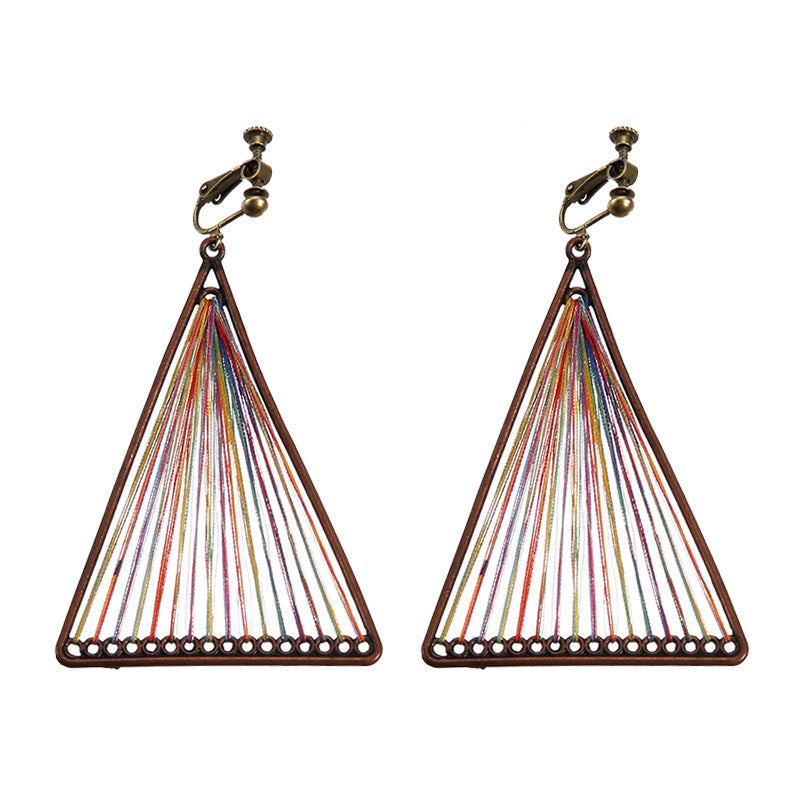 Bohemian tassel and bead clip-on drop earrings, aged tone zinc alloy frame, handmade pair on plain white background