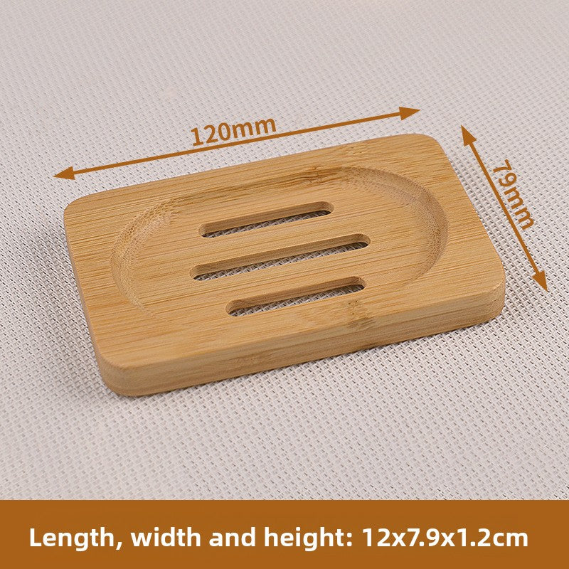 Rectangular 3 hole bamboo soap dish measuring 12 x 7.9 x 1.2 cm on a woven mat