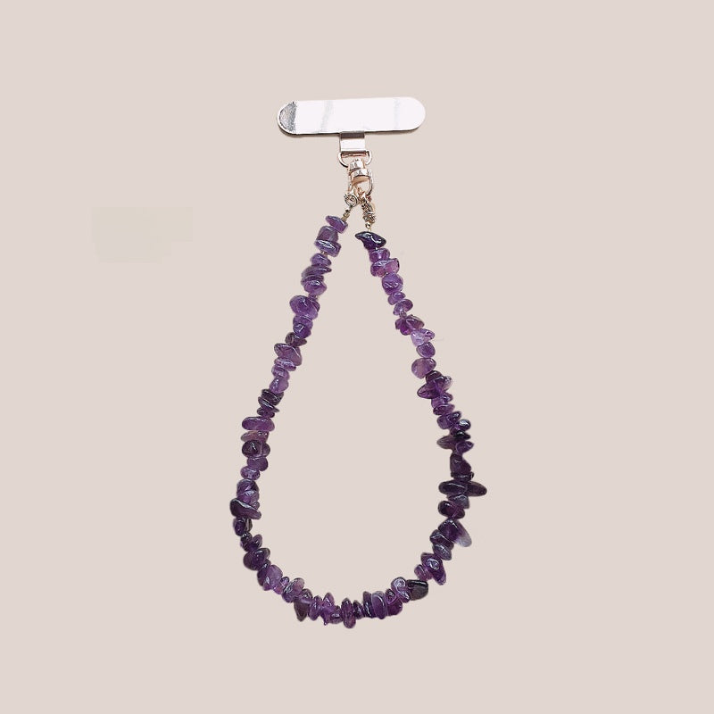 Purple bead phone strap clipped to a phone and carried at the wrist