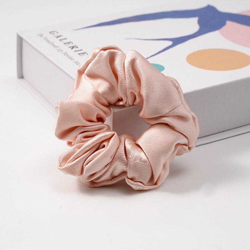White satin scrunchie with black polka dots