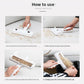 Reusable pet hair roller clearing pet fur from a fabric sofa cushion in use