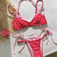 Polka dot triangle bikini top and tie side brief worn outdoors with neck tie halter straps
