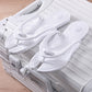 Foldable EVA travel slipper with a quilted cushioned footbed shown in a studio product photo