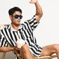Striped swim trunks styled with a casual tee on set