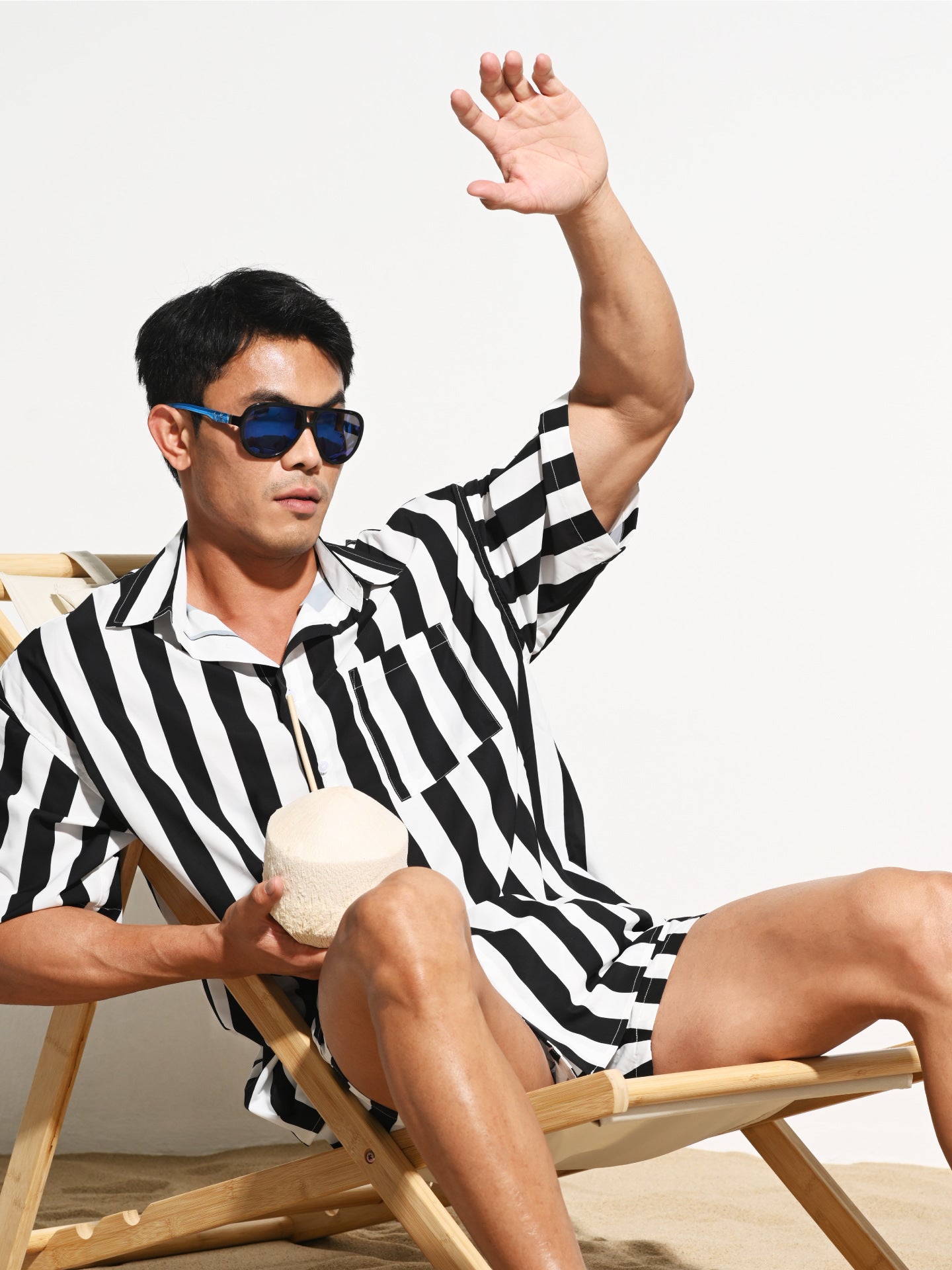 Striped swim trunks styled with a casual tee on set