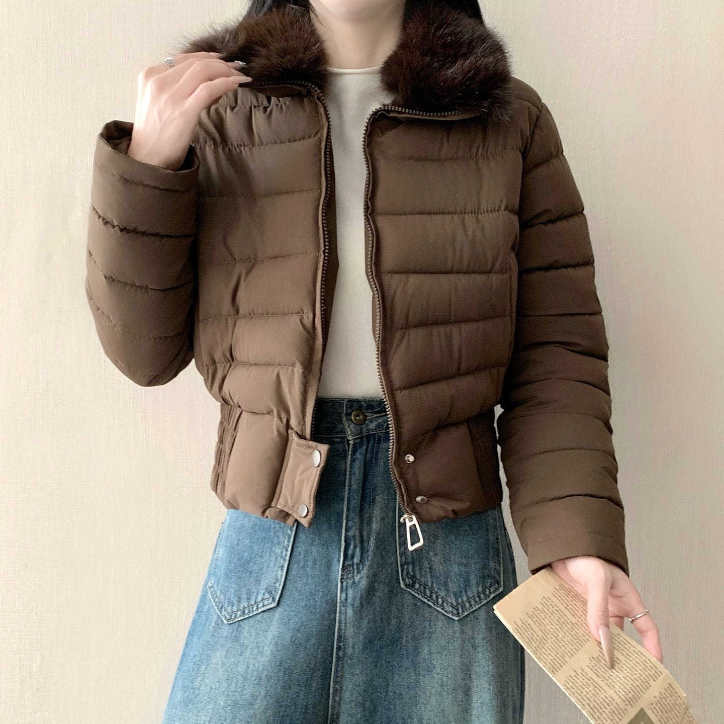 White cropped padded puffer jacket with a soft faux fur turn down collar on a model