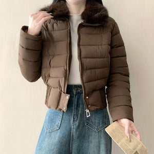 White cropped padded puffer jacket with a soft faux fur turn down collar on a model
