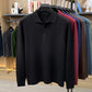Black long sleeve knit polo shirt with three button placket and ribbed hem, size XXXXL