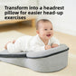 Baby lying on its tummy over the raised end of a grey wedge lounger pillow, with a text overlay