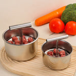 Two stainless steel meatball makers, small six hole and large twelve hole, with shaped meatballs