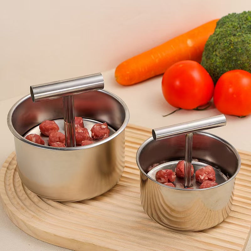 Two stainless steel meatball makers, small six hole and large twelve hole, with shaped meatballs