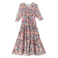 Printed mulberry silk dress styled in a modern interior scene