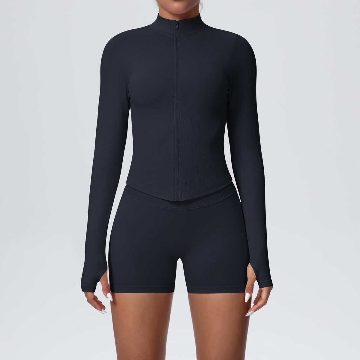 Womens seamless activewear set with a long sleeve zip jacket and matching high waist shorts